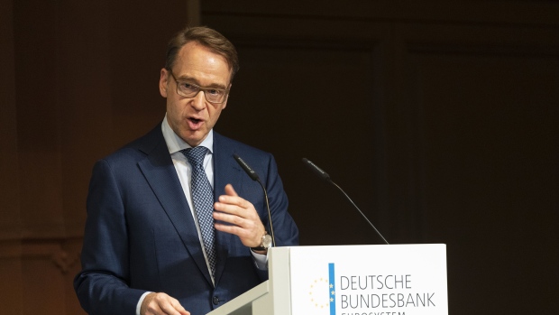 Jens Weidmann, president of the Deutsche Bundesbank, gestures while delivering a speech at the Deutsche Bundesbank financial market conference in Frankfurt, Germany, on Tuesday, Oct. 29, 2019. Weidmann warned that giving preference to green bonds when conducting quantitative easing policies risks overburdening central banks and could eventually endanger their independence.