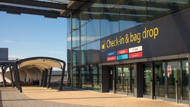 An entrance to the Check-in & Bag at North Terminal stands closed at London Gatwick Airport, operated by Gatwick Airport Ltd., in Crawley, U.K., on Monday, May 18, 2020. The coronavirus is muddying the outlook for London's second-biggest airport. Photographer: Jason Alden/Bloomberg