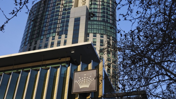 The Crown Resorts Ltd. logo at the Crown Resorts Ltd. logo atop the Crown Sydney hotel resort and the One Barangaroo Crown residences in Sydney, Australia, on Tuesday, Feb. 16, 2021. The crisis enveloping Crown deepened after a state regulator recommended an inquiry into the company’s fitness to run its Perth casino hours after the company was formally found unsuitable to operate a Sydney casino. Photographer: Brent Lewin/Bloomberg