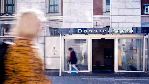 Pedestrians pass a Danske Bank A/S bank branch in Aalborg, Denmark, on Monday, Sept. 14, 2020. Denmark is re-introducing a number of coronavirus-related restrictions following the worst spike in infections since the height of the pandemic.