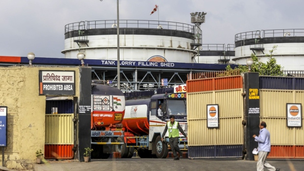 Indian Oil Corp. oil tanks stand near the Jawaharlal Nehru Port, operated by Jawaharlal Nehru Port Trust (JNPT), in Navi Mumbai, Maharashtra, India, on Saturday, May 25, 2019. President Donald Trump opened another potential front in his trade war on May 31, terminating India's designation as a developing nation and thereby eliminating an exception that allowed the country to export nearly 2,000 products to the U.S. duty-free. Photographer: Dhiraj Singh/Bloomberg