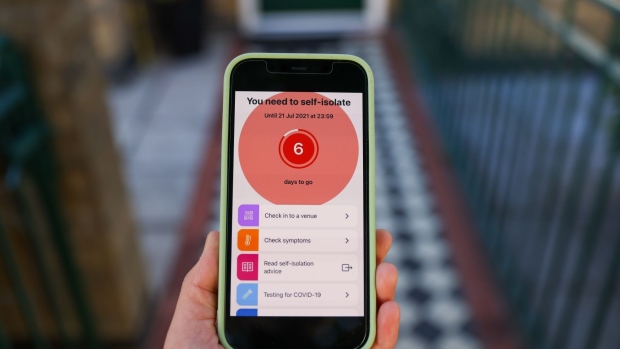 An app option menu for the NHS Covid-19 app on a smartphone arranged in London, U.K., on Friday, July 16, 2021. U.K. ministers are racing to change the rules on self-isolation after a surge in alerts from the country’s Covid-19 app takes people out of their workplaces and disrupts business. Photographer: Hollie Adams/Bloomberg