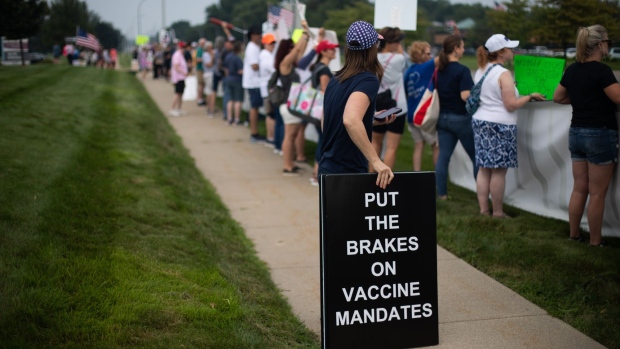 Anti-vaccine protesters for healthcare workers in Michigan, U.S. Photographer: Emily Elconin/Bloomberg