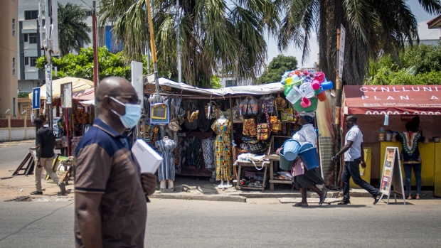 A roadside clothing stall in Accra, Ghana, on Tuesday, Oct. 23, 2020. Ghana is missing out on a rally of African bonds as investors fret about an expansion in spending and borrowing ahead of elections in December. Photographer: Cristina Aldehuela/Bloomberg