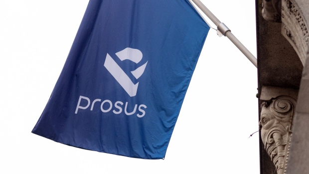 A Prosus flag is displayed ahead of the trading debut of the new Prosus NV unit of Naspers Ltd., outside the Amsterdam Stock Exchange, operated by Euronext NV, in Amsterdam, Netherlands, on Wednesday, Sept. 11, 2019. Naspers will retain 73% of the new company, which will house everything from a 31% stake in Chinese online giant Tencent to food delivery and advertising firms from the U.S. to India and Brazil. Photographer: Bloomberg/Bloomberg