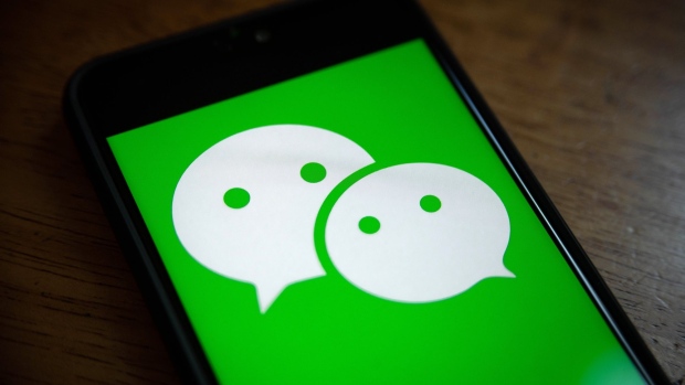 The logo for Tencent Holdings Ltd.'s WeChat app is arranged for a photograph on a smartphone in Hong Kong, China, on Friday, Aug. 7, 2020. President Donald Trump signed a pair of executive orders prohibiting U.S. residents from doing business with the Chinese-owned TikTok and WeChat apps beginning 45 days from now, citing the national security risk of leaving Americans' personal data exposed.