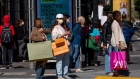 Shoppers hold bags in San Francisco. Photographer: David Paul Morris/Bloomberg