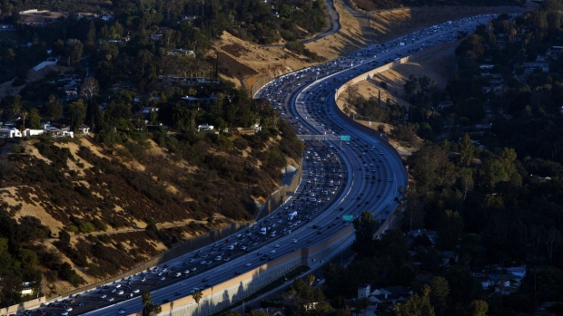 Cars moves along during rush hour traffic on the 405 Freeway through the Sepulveda pass in this aerial photograph taken over Los Angeles, California, U.S. Photographer: Patrick T. Fallon