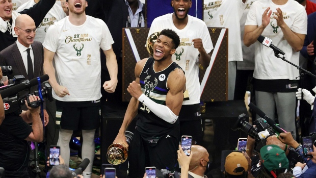 Giannis Antetokounmpo celebrates winning the Bill Russell NBA Finals MVP Award after winning the 2021 NBA Finals at Fiserv Forum on July 20, 2021 in Milwaukee.