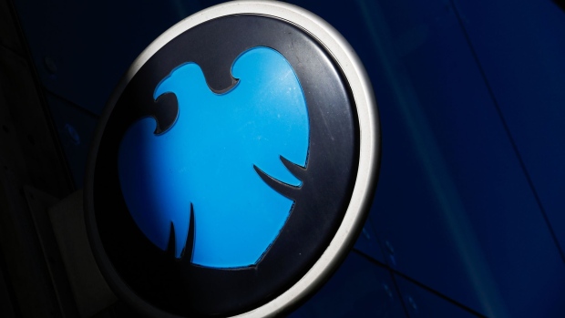 A logo for a Barclays Plc bank branch sits on a sign in London, U.K., on Tuesday, March 21, 2017. Barclays is considering Dublin for their EU base to ensure continued access to the single market, said people familiar with the plans,asking not to be named because the plans aren't public. Photographer: Luke MacGregor/Bloomberg