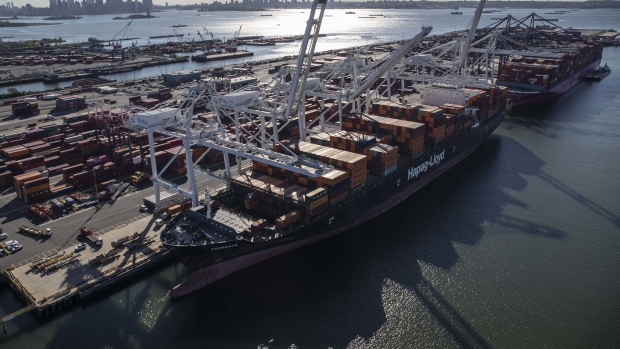 Shipping containers on a cargo ship at Bayonne Terminal in Bayonne, New Jersey, U.S., Thursday June 17, 2021. New Jersey had zero in-hospital coronavirus deaths Thursday for the first time since July, Governor Phil Murphy said on Twitter. Photographer: Victor J. Blue/Bloomberg