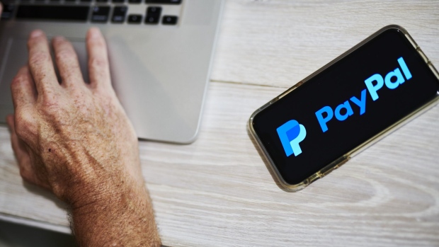 PayPal Holdings Inc. signage is displayed on an Apple Inc. iPhone in an arranged photograph taken in Little Falls, New Jersey, U.S., on Saturday, July 20, 2019. Paypal Holdings Inc. is scheduled to release earnings figures on July 24. Photographer: Gabby Jones/Bloomberg