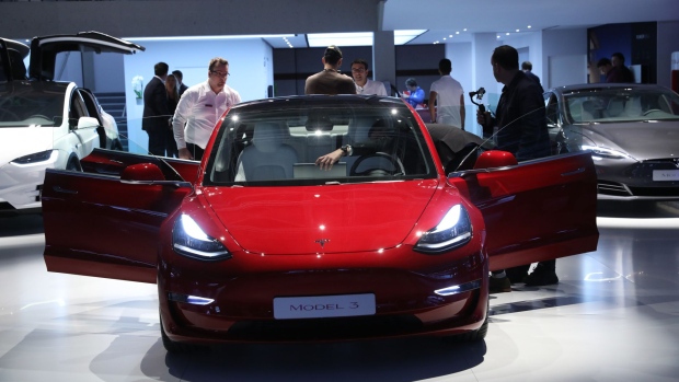 A Tesla Inc. Model 3 electric automobile stands on display during the Paris Motor Show, in Paris, France.