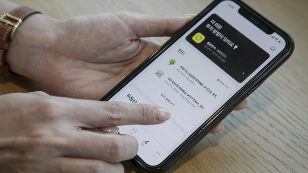 The Kakao Pay Corp. application on a smartphone arranged at the company's headquarters in Seongnam, South Korea, on Monday, May 24, 2021. Kakao Pay, South Korea’s largest online payment service with 36 million users, is seeking to raise as much as 1.63 trillion won ($1.4 billion) in an initial public offering in Seoul, following blockbuster IPO filings from Kakao Bank and Krafton Inc. this week.