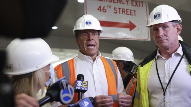 Andrew Cuomo, governor of New York, center, speaks during a media tour with Janno Lieber, chief development office for Metropolitan Transportation Authority (MTA), right, at Grand Central Terminal in New York, U.S., on Thursday, May 27, 2021. Governor Cuomo today announced the completion of civil construction on East Side Access - the MTA's megaproject connecting the Long Island Rail Road to a new 350,000-square-foot passenger terminal under Grand Central Terminal. This is the largest new train terminal to be built in the United States since the 1950s.