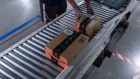 Boxes move along a conveyor belt at an Amazon fulfillment center on Prime Day in Raleigh, North Carolina, U.S., on Monday, June 21, 2021. Amazon.com Inc.'s annual Prime Day sale, which begins Monday, arrives as the world grapples with the lingering effects of the pandemic.