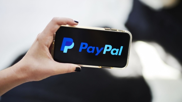 PayPal Holdings Inc. signage is displayed on an Apple Inc. iPhone in an arranged photograph taken in Little Falls, New Jersey, U.S., on Saturday, July 20, 2019. Paypal Holdings Inc. is scheduled to release earnings figures on July 24. Photographer: Gabby Jones/Bloomberg