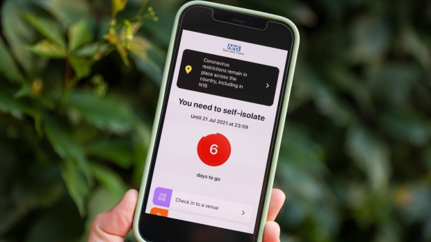 A "You need to self-isolate screen" on the NHS Covid-19 app on a smartphone arranged in London, U.K., on Friday, July 16, 2021. U.K. ministers are racing to change the rules on self-isolation after a surge in alerts from the country’s Covid-19 app takes people out of their workplaces and disrupts business.