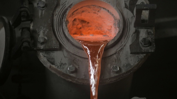 Molten aluminium is poured from a crucible transport and tilting vehicle into a furnace in the cast house unit of the Vedanta Ltd. Aluminium Smelter in Jharuguda district, Odisha, India, on Wednesday, June 19, 2019. Vedanta Resources Ltd., owned by Indian billionaire Anil Agarwal, mines and processes copper, zinc and aluminum seams with a focus on India, but has operations in Zambia, Sri Lanka, South Africa and Australia as well.