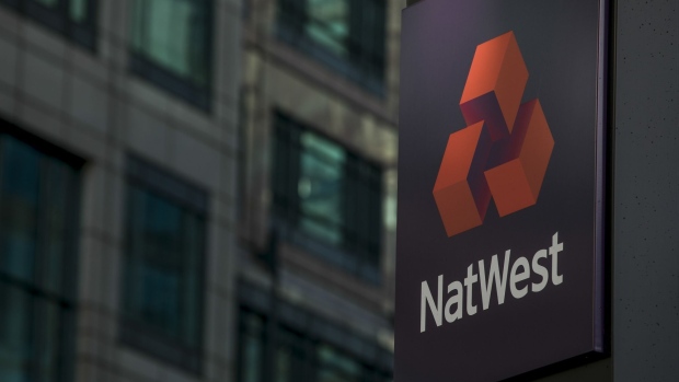 The logo of NatWest Plc, stands on display in front of the headquarters of the Royal Bank of Scotland Group Plc in London, U.K. on Monday, Feb. 17, 2020. RBS's new boss Alison Rose is abandoning the bank's three-centuries-old name and renaming the bank NatWest Group Plc later of this year. Photographer: Jason Alden/Bloomberg