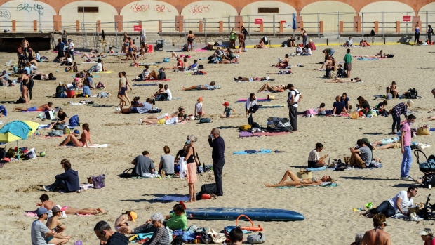 Sunbathers on Catalan beach in Marseille, France, on Sunday, April 25, 2021. The European Union plans to open its doors this summer to U.S. tourists who've been fully vaccinated against Covid-19, the New York Times reported, citing the head of the blocs executive body.