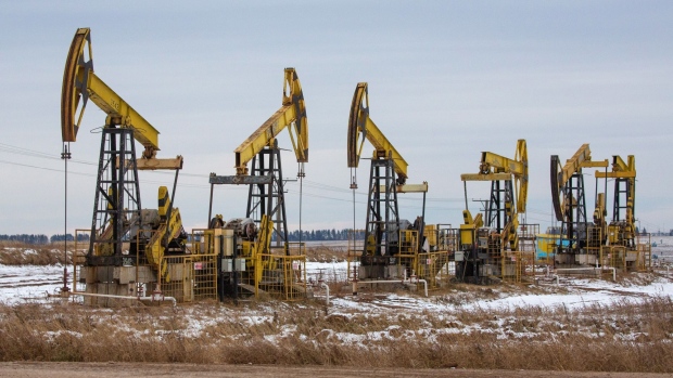 Oil pumping jacks, also known as "nodding donkeys"in a Rosneft Oil Co. oilfield near Sokolovka village, in the Udmurt Republic, Russia, on Friday, Nov. 20, 2020. The flaring coronavirus outbreak will be a key issue for OPEC+ when it meets at the end of the month to decide on whether to delay a planned easing of cuts early next year. Photographer: Andrey Rudakov/Bloomberg