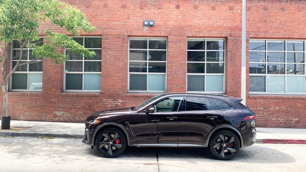 The “SVO Ultra Metallic Paint in Gloss finish,” in a dark aubergine, and 22-inch split-blade wheels are among the many options on Jaguar’s big-cat V8.  Photographer: Hannah Elliott/Bloomberg