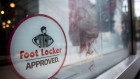 Foot Locker Inc. signage is displayed on the window of a store in downtown Chicago, Illinois, U.S., on Sunday, May 13, 2018. Foot Locker Inc. is scheduled to release earnings figures on May 25. Photographer: Christopher Dilts/Bloomberg