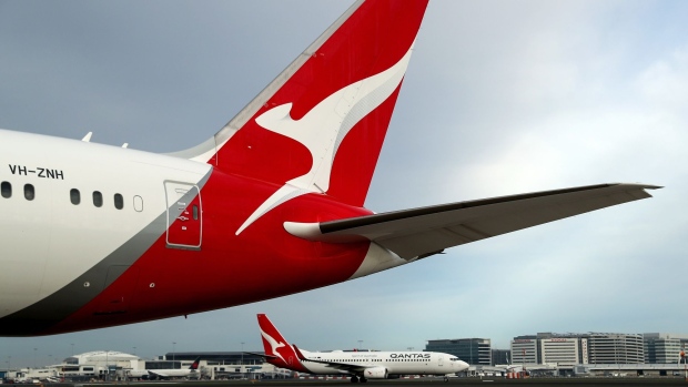 Aircraft operated by Qantas Airways Ltd. on the tarmac at Sydney Airport in Sydney, Australia, on Wednesday, June 23, 2021. While losses at airlines globally from Covid-19 are set to surpass $174 billion by the end of 2021 -- wiping out half a decade of profits -- Qantas has become one of the most financially secure carriers anywhere in the world. Photographer: Brendon Thorne/Bloomberg