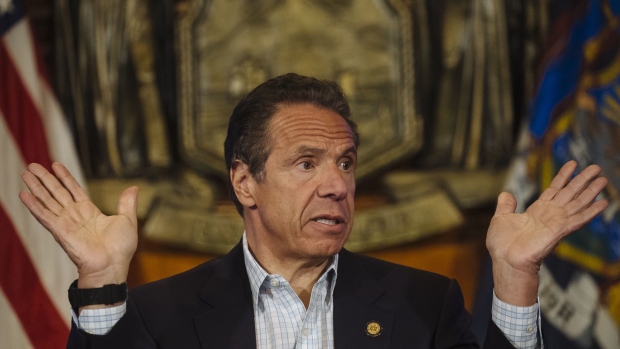 Andrew Cuomo, governor of New York, speaks during a news conference in the Red Room of the New York State Capitol Building in Albany, New York, U.S., on Sunday, May 17, 2020. Cuomo pleaded on Sunday for more New Yorkers to get tested for the coronavirus as the state reopens for business, engaging in a bit of political theater as he underwent a nasal swab test himself at his daily briefing. Photographer: Angus Mordant/Bloomberg