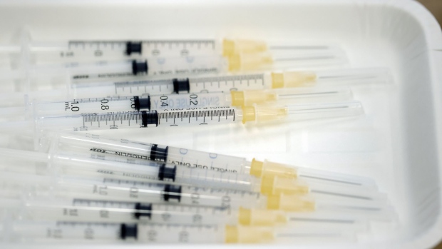 Syringes filled with doses of the Moderna Inc. Covid-19 vaccine on a tray at a vaccination site at Suntory Holdings Ltd.'s office in Tokyo, Japan, on Monday, June 21, 2021. The addition of workplace vaccinations is expected to help Japan reach its goal of a million shots per day by the end of June, the country’s vaccine czar Taro Kono told reporters last week.