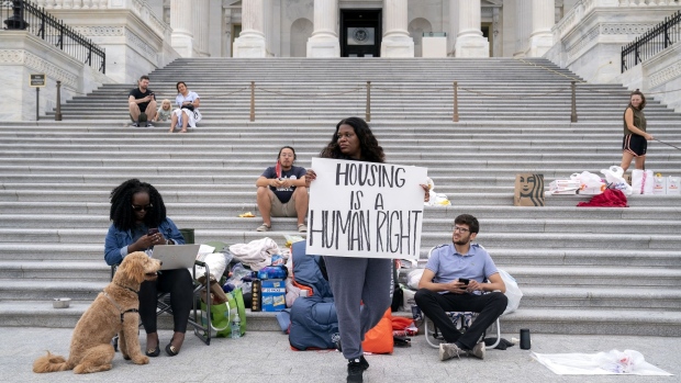 Cori Bush, center, joined by Congressional staffers and activists, protests the expiration of the eviction moratorium outside of the U.S. Capitol on July 31.