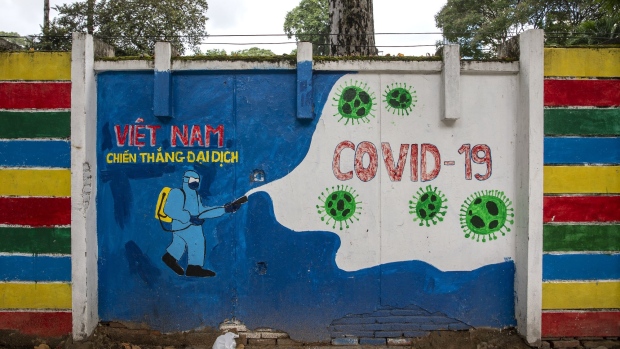 A 'Covid-19' mural in Ho Chi Minh City, Vietnam, on Monday, June 21, 2021. Vietnam was one of the few economies in the world that didn’t contract last year, and officials are keen to ensure it remains among the fastest-expanding this year, but a nationwide virus surge -- leading to lockdown-like conditions in the nation’s commercial hub of Ho Chi Minh City, the capital Hanoi and other regions -- risks becoming a drag on that goal. Photographer: Maika Elan/Bloomberg