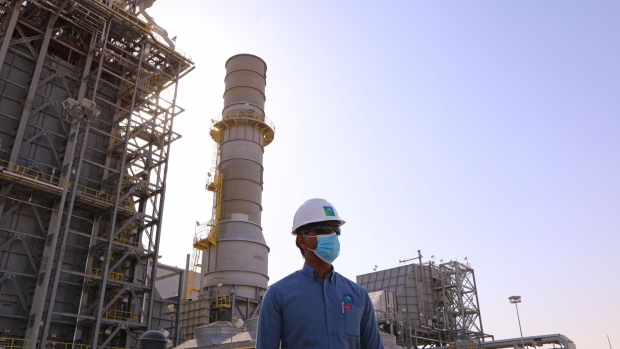 An employee near an oil processing facility at the Khurais Processing Department in the Khurais oil field in Khurais, Saudi Arabia, on Monday, June 28, 2021. The Khurais oil field was built as a fully connected and intelligent field, with thousands of sensors covering oil wells spread over 150km x 40km in order to increase the efficiency of the plant and reduce emississions, according to a Saudi Aramco statement released to the media.