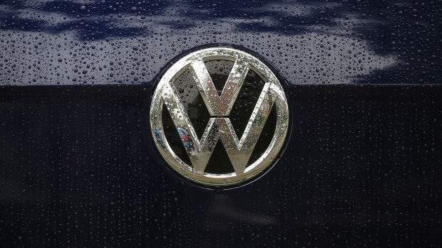 Raindrops rest on the badge of a used Volkswagen Golf automobile outside a Volkswagen AG (VW) showroom in Berlin, Germany, on Wednesday, July 26, 2017. Carmakers' shares have dropped since Spiegel magazine reported Friday that Daimler and Volkswagen informed authorities last year of discussions they'd had since the 1990s that also included BMW AG. Photographer: Krisztian Bocsi/Bloomberg