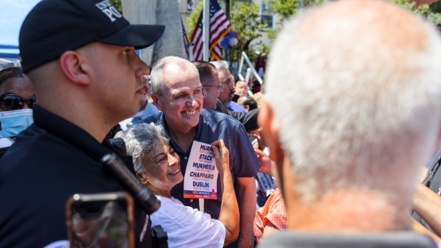 Phil Murphy, center, takes a photograph with supporters during a 'Get Out The Vote' rally in Union City, New Jersey, on June 5.