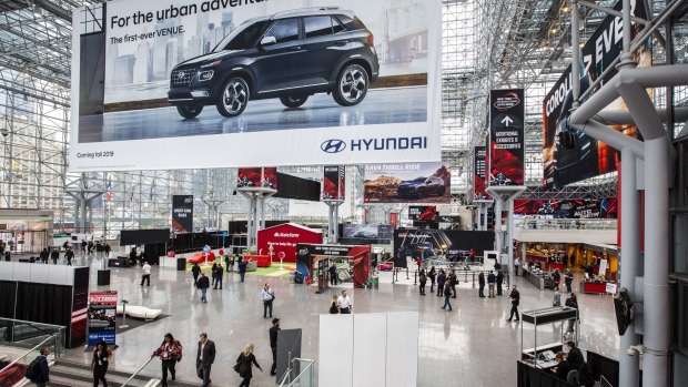 An advertisement for the Hyundai Motor Co. Venue sports utility vehicle (SUV) hangs on display during the 2019 New York International Auto Show (NYIAS) in New York, U.S., on Thursday, April 18, 2019. The NYIAS, North America's first and largest-attended auto show dating back to 1900, showcases an incredible collection of cutting-edge design and extraordinary innovation. Photographer: Natan Dvir/Bloomberg