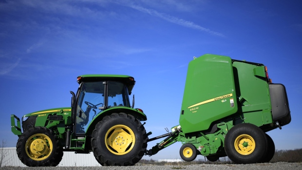 A Deere & Co. tractor and round baler for sale at a John Deere dealership in Shelbyville, Kentucky, U.S., on Thursday, Nov. 19, 2020. Deere & Co. is scheduled to release earnings figures on November 25. Photographer: Luke Sharrett/Bloomberg