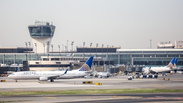 A United Continental Holdings Inc. airplane taxis outside the company's terminal at Newark Liberty International Airport (EWR) in Newark, New Jersey, U.S., on Wednesday, April 12, 2017. United Airlines is under fire for forcibly removing a passenger from a plane in Chicago shortly before departure to make room for company employees, an incident which demonstrates how airline bumping can quickly veer into confrontation.