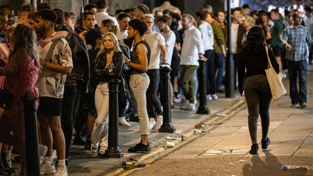 LONDON, ENGLAND - JULY 24: A long queue of club-goers waiting to get in to Heaven nightclub on July 24, 2021 in London, England. On Monday, July 19th the remaining Coronavirus lockdown measures across England were lifted. Nightclubs and Theatres reopened and general mask-wearing rules have been relaxed. (Photo by Rob Pinney/Getty Images)