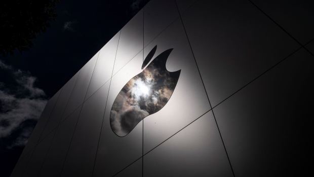 The Apple logo on a store in San Francisco, California, U.S., on Monday, April 26, 2021. Apple Inc. is increasing its U.S. investments by 20% over the next five years, allocating $430 billion to develop next-generation silicon and spur 5G wireless innovation across nine U.S. states, after outstripping its growth expectations during the pandemic. Photographer: Bloomberg/Bloomberg