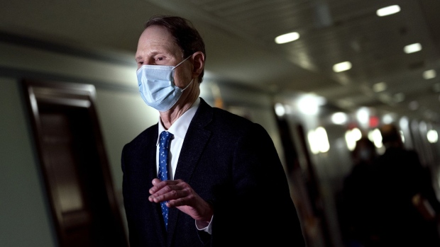 Senator Ron Wyden, a Democrat from Oregon and ranking member of the Senate Finance Committee, speaks to members of the media before a committee executive session in Washington, D.C., U.S., on Friday, Jan. 22, 2021. The committee is meeting to vote on advancing Janet Yellen's nomination to be treasury secretary.
