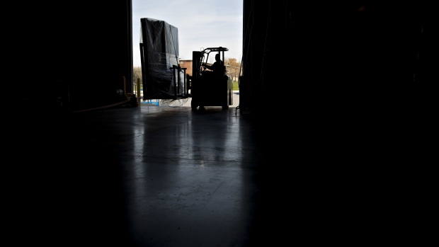 An employee moves an order of walls on a forklift at the Blueprint Robotics facility in Baltimore, Maryland, U.S., on Tuesday, April 10, 2017. The Blueprint factory is one of the first in the U.S. to use robots to help manufacture modular homes, and these robots are creating opportunities for people who wouldn't otherwise be a part of the homebuilding industry. Photographer: Andrew Harrer/Bloomberg