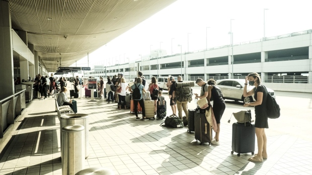 Travelers arrive at the Detroit Metropolitan Wayne County Airport in Romulus, Michigan.