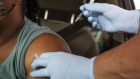 A healthcare worker administers a Covid-19 vaccine at the Austin Regional Clinic drive-thru vaccination and testing site in Austin, Texas, U.S., on Thursday, Aug. 5, 2021. In a virtual briefing Wednesday, the Texas Department of State Health Services said hospitalizations and cases are rising in the state in unvaccinated people, largely because of the delta variant, reports NBC-affiliate KXAN. Photographer: Matthew Busch/Bloomberg