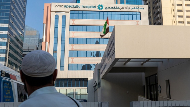 A logo sits on display outside the NMC Speciality Hospital, operated by NMC Health Plc, in Dubai, United Arab Emirates, on Sunday, March 1, 2020. Troubled NMC Health Plc, the largest private health-care provider in the United Arab Emirates, asked lenders for an informal standstill on its debt as Dubai weighs an injection of capital to safeguard the emirate’s reputation among global investors. Photographer: Christopher Pike/Bloomberg