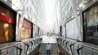 A pedestrian walks down stairs at Brookfield Place in the financial district of Toronto, Ontario, Canada, on Friday, May 22, 2020. Whether the PATH, a subterranean network that provides connections between major commuter stations, over 80 properties, including the headquarters of Canada's five largest banks, and 1,200 retail spots, can return to its glory days will depend initially on how quickly Bay St. firms return workers to their offices.