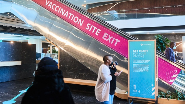 A health and safety information board at the exit to the Discovery head office vaccination site in the Sandton business district of Johannesburg, South Africa, on Tuesday, July 27, 2021. The country has issued more than 6.3 million vaccines so far, and will have enough shots to last until the end of the year, with 31 million doses from Johnson & Johnson and Pfizer Inc. expected to arrive within in the next three months.