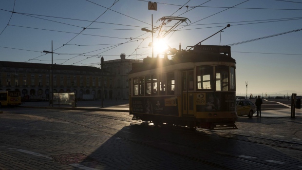 A city tram passes across Praca do Comercio square during the Lisbon Web Summit in Lisbon, Portugal, on Tuesday, Nov. 7, 2017. Portugal is hoping to bolster its reputation as a startup hub in Europe at a time when political instability in Spain’s Catalonia and the U.K.’s decision to exit the European Union are triggering growing interest in the southern European country.
