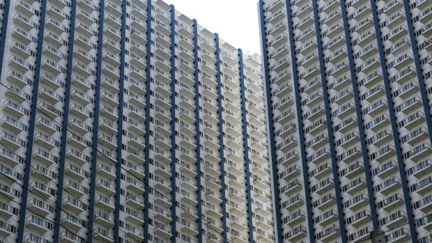 Residential building stand in Manila, the Philippines, on Monday, June 17, 2019. Manila, one of the largest and most congested urban areas in the world, has a solution to its problems: build artificial islands in the sea. Manila’s dilemma is one shared by many fast-growing cities in developing nations. Rapid growth in population⁠—boosted by migration from rural areas⁠—is overwhelming services, roads, transportation, power and drainage. Photographer: Veejay Villafranca/Bloomberg